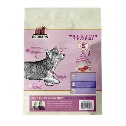 Bag of Redbarn Whole Grain Puppy Recipe Dog Food with a drawing of a corgi puppy