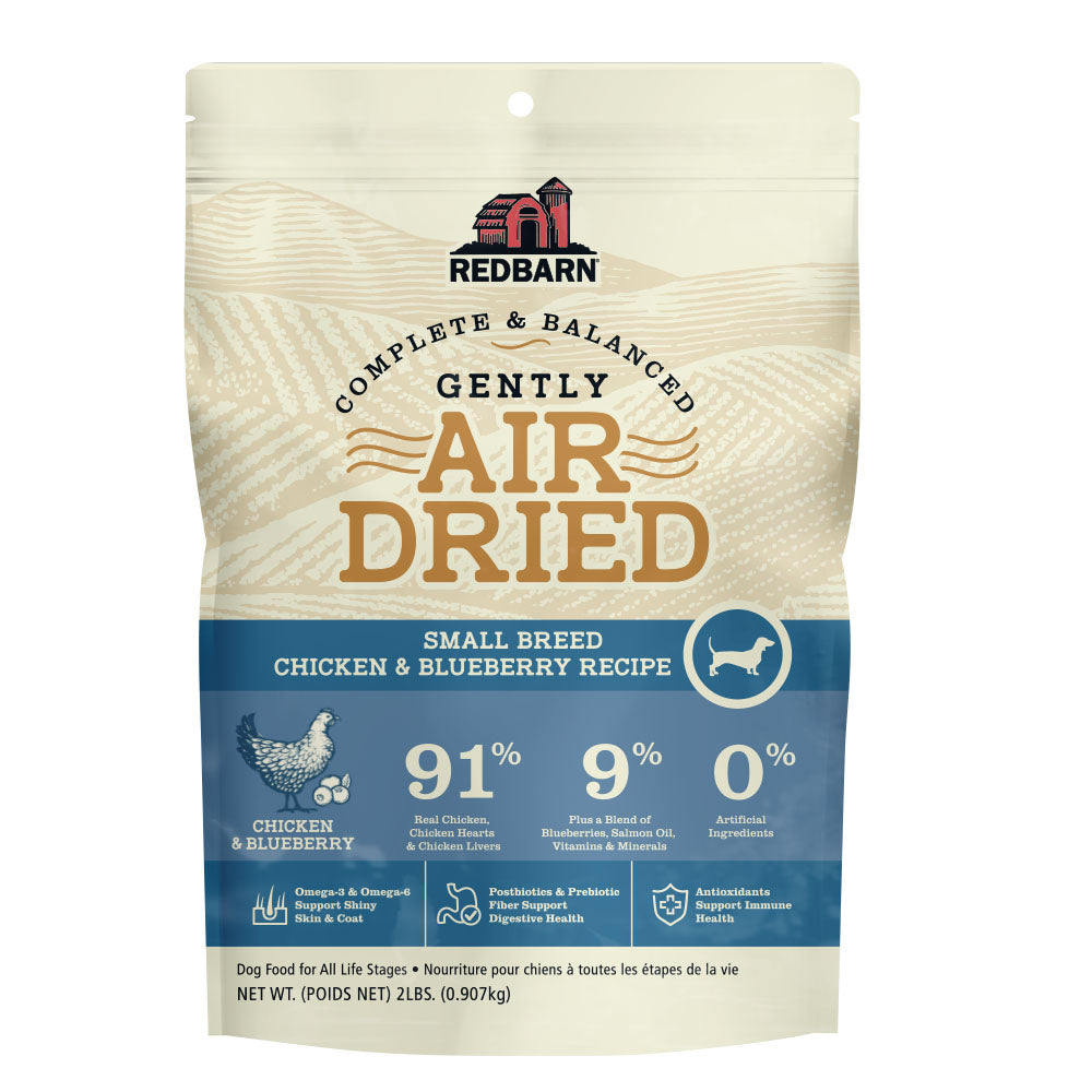 Tan and blue bag stating Air Dried Dog Food for Small Breeds - Chicken and Blueberry Flavor.